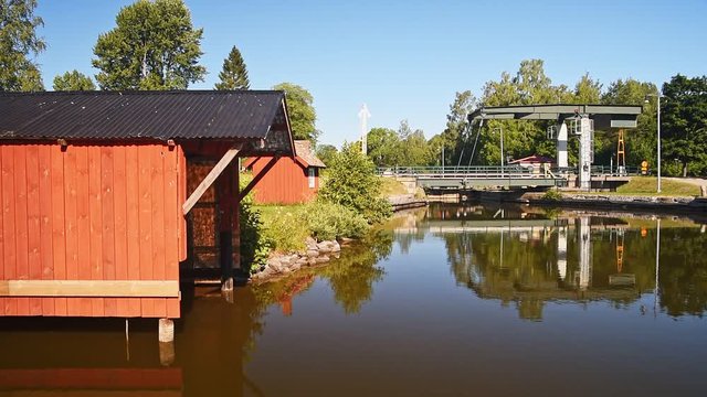 Small bascule bridge over Gota canal in lovely summer landscape at Tatorp in Sweden.