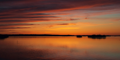 A natural  Dramatic,  blazing   sunset in the Baltic sea. Bright sky and clouds. beautiful seascape as background