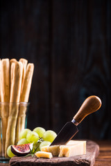 Parmesan cheese pieces cut by cheese knife