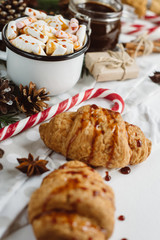 Winter hot drink. Christmas hot chocolate or cocoa with marshmallow, cookies   on white background with christmas decorations. Flat Lay.