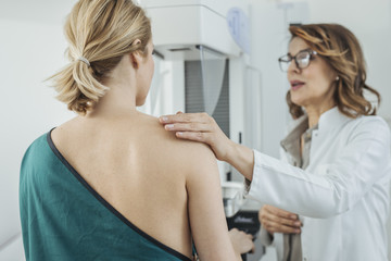 Woman Physician Talking With Her Patient