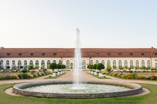 The main building of the Orangery and the fountain in the Central Park of Ansbach, Bavaria Germany