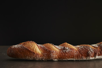 French baguette on black background 