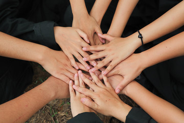 Closeup of young women's hands show sign of commitment.