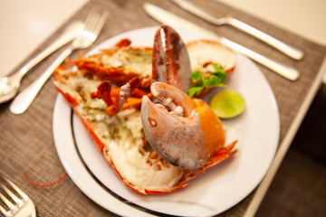 Simple yet delicious. Hot and freshly baked halved Lobster with butter. Fresh, juicy and tasty bright red Maine Lobster or American lobster. Sweet and flavorful lobster. Rich in omega-3 fatty acid