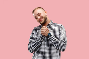 Happy businessman standing, smiling isolated on trendy pink studio background. Beautiful male half-length portrait. Young satisfy man. Human emotions, facial expression concept. Front view.