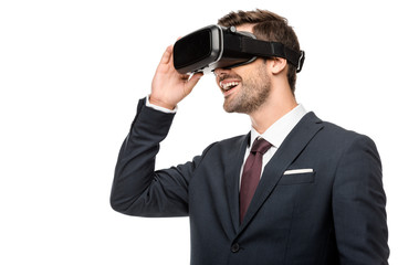 happy young businessman using virtual reality headset isolated on white