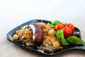 Homemade Sausage Cooked lentils with baby onions and carrots