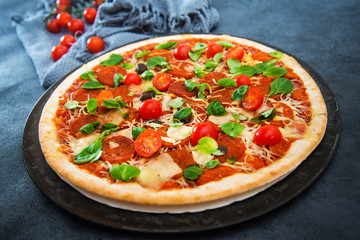 Sausage Pizza with Ham and tomatoes