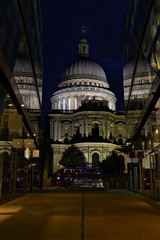 Fototapeta na wymiar St Paul's Cathedral and reflections at night in London