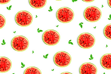 Pattern food background from the pulp of watermelon on a round slice , view from above closeup, the texture of the food against the background of colored paper
