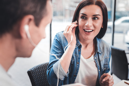 You Guessed. Beautiful Girl Keeping Eyes Wide Opened While Listening To Favorite Song