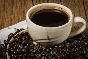 A coffee bean is a seed of the coffee plant and the source for coffee.