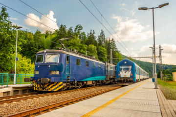 Two blue trains at the station. Rail transport in the Czech Republic. A sunny day on the railroad
