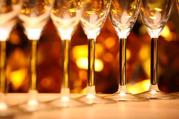 Empty champagne glass gold bokeh studio 