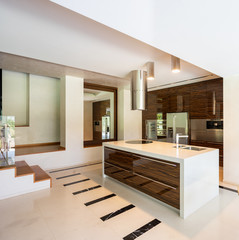 Modern kitchen in wood and marble with island