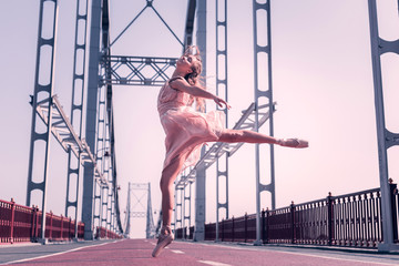 I feel free. Nice young woman jumping in the air while performing a dance © Viacheslav Yakobchuk