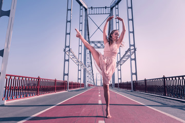 Expression of emotions. Nice professional female dancer jumping up while expressing her emotions © Viacheslav Yakobchuk