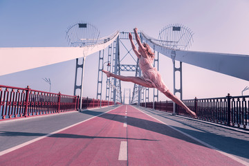 Wonderful emotions. Beautiful graceful young woman being in the air while enjoying her freedom © Viacheslav Yakobchuk