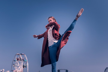 Feel the dance. Pleasant nice dancer focusing on her movements while performing a dance © Viacheslav Yakobchuk