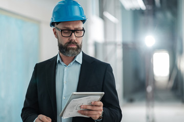 Middle-aged engineer in hardhat