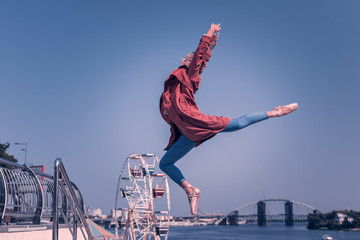 This is freedom. Nice happy woman feeling absolute freedom while jumping into the air © Viacheslav Yakobchuk