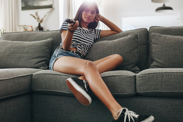 Girl sitting on couch at home