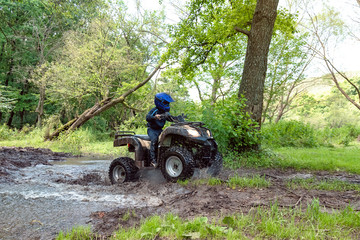 A trip on the ATV on the red road.