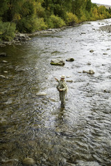 Fly Fisher man in the Rockies