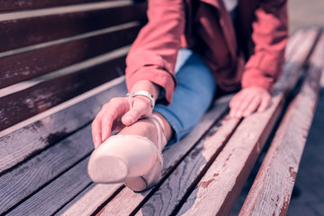 On the bench. Close up of professional dancers leg in pointe shoes © Viacheslav Yakobchuk