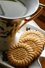 Cup of tea with biscuits close up