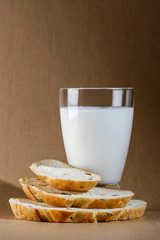 glass of milk with bread and cheese