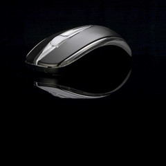 Black computer mouse on black background