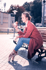 End of the diet. Joyful happy woman eating a delicious hamburger while ending her diet © Viacheslav Yakobchuk