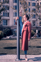 Talented dancer. Nice skilled young woman standing near the lantern while showing her talent © Viacheslav Yakobchuk