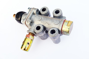 Actuation valve of the divider gearbox of a truck on an isolated white background