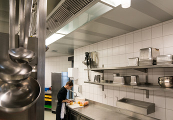 young, woman, female, short-haired, profession, job, work, worker, cook, cooking, chef, sous chef, prepare, line cook, uniform, restaurant, kitchen, restaurant kitchen, food and beverage, food and bev
