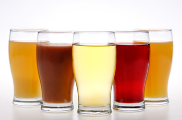 glasses of juice and fruits