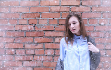 Young girl outdoors in winter. Model girl posing outdoors on a w