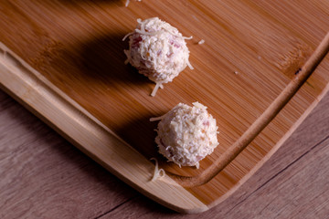 Tasty cheese balls served in the wooden plate