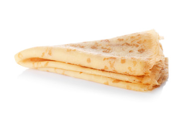 Tasty thin folded pancake on white background
