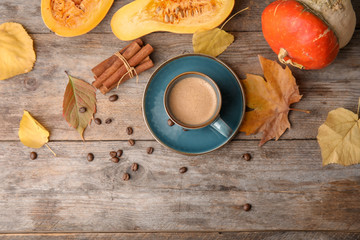 Flat lay composition with pumpkin spice latte and space for text on wooden background