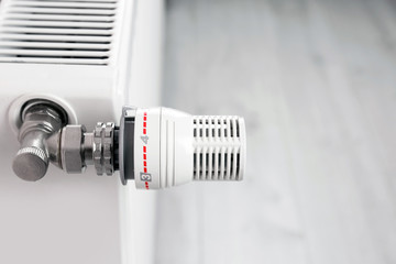 Heating radiator with manual thermostat, closeup view