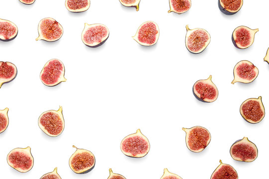 Frame made of cut ripe figs on white background, top view. Space for text