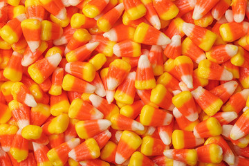 Delicious candy corns as background, top view