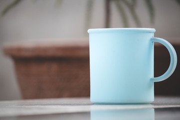 cup of coffee on wooden table