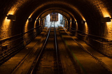 The Dark underground metro line - Train Tunnel.
fragment of a underground tunnel
