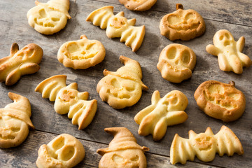 Homemade Halloween cookies on wooden table background.  - obrazy, fototapety, plakaty