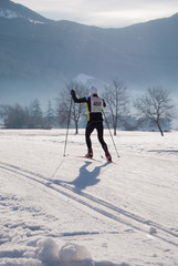 Man in a skiing competition in a sunny day