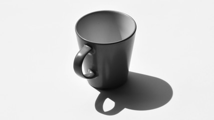 grey ceramic cup of coffee with shadow